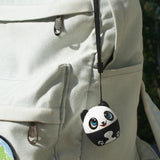 My Audio Pet Pandamonium Wireless Bluetooth Speaker with True Wireless Stereo Panda hanging with supplied lanyard on a cool backpack